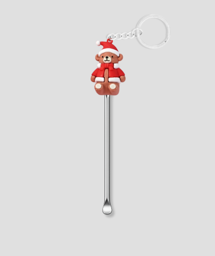 schep met kerstpoppetje