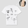 Wit unisex t-shirt met tattoo-geïnspireerde opdrukken van PEP SCHEP – voorkant print met diverse kleine illustraties zoals panda, hart, bloem en typografie, eigen tattoo uploadbaar