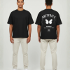 Zwart T-shirt met witte vlinder illustratie, BUTTERFLY tekst in gothic letters en bliksemschichten op de rug