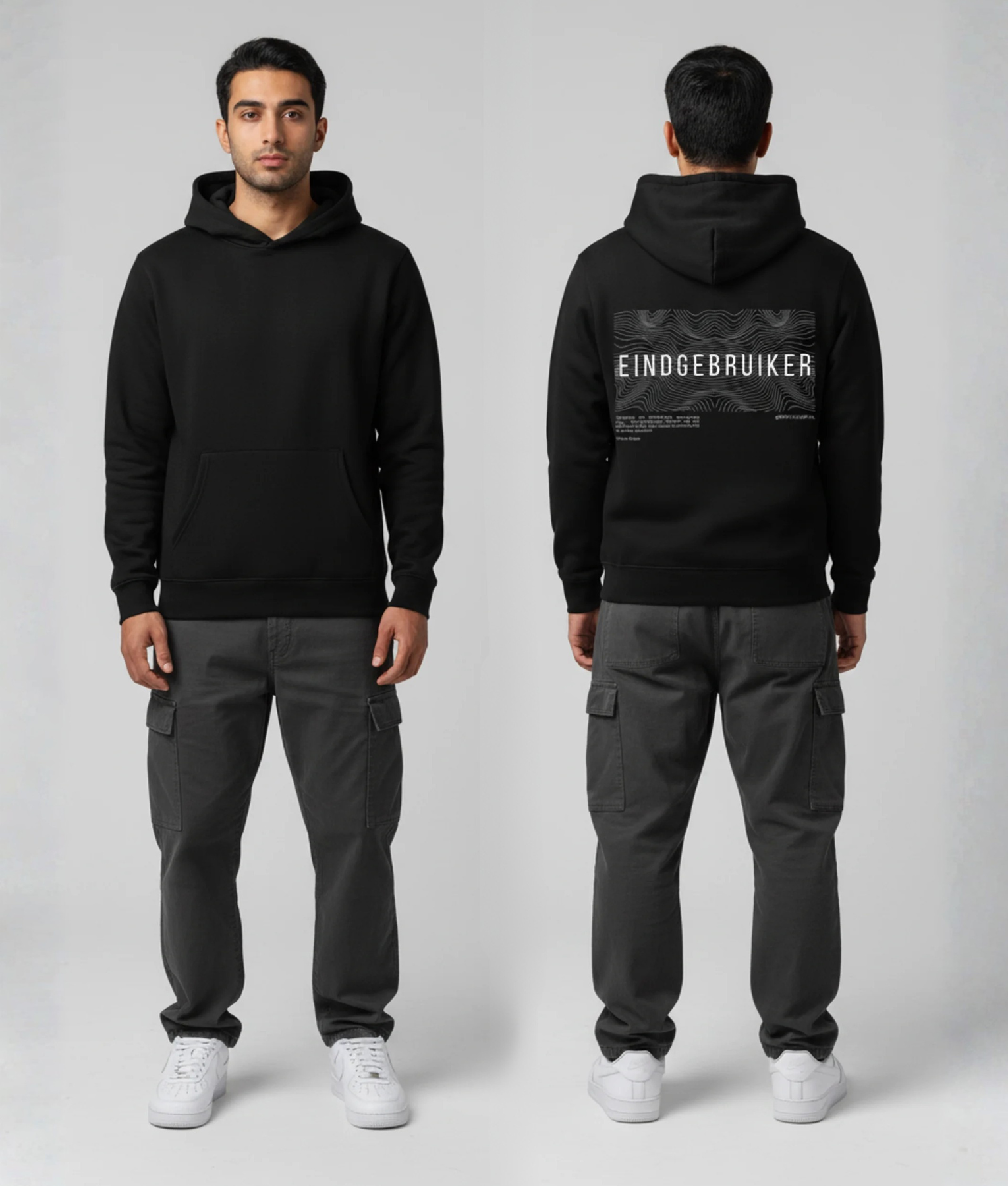 Man in zwarte hoodie voor- en achterkant met witte EINDGEBRUIKER tekst en golfpatroon print op de rug