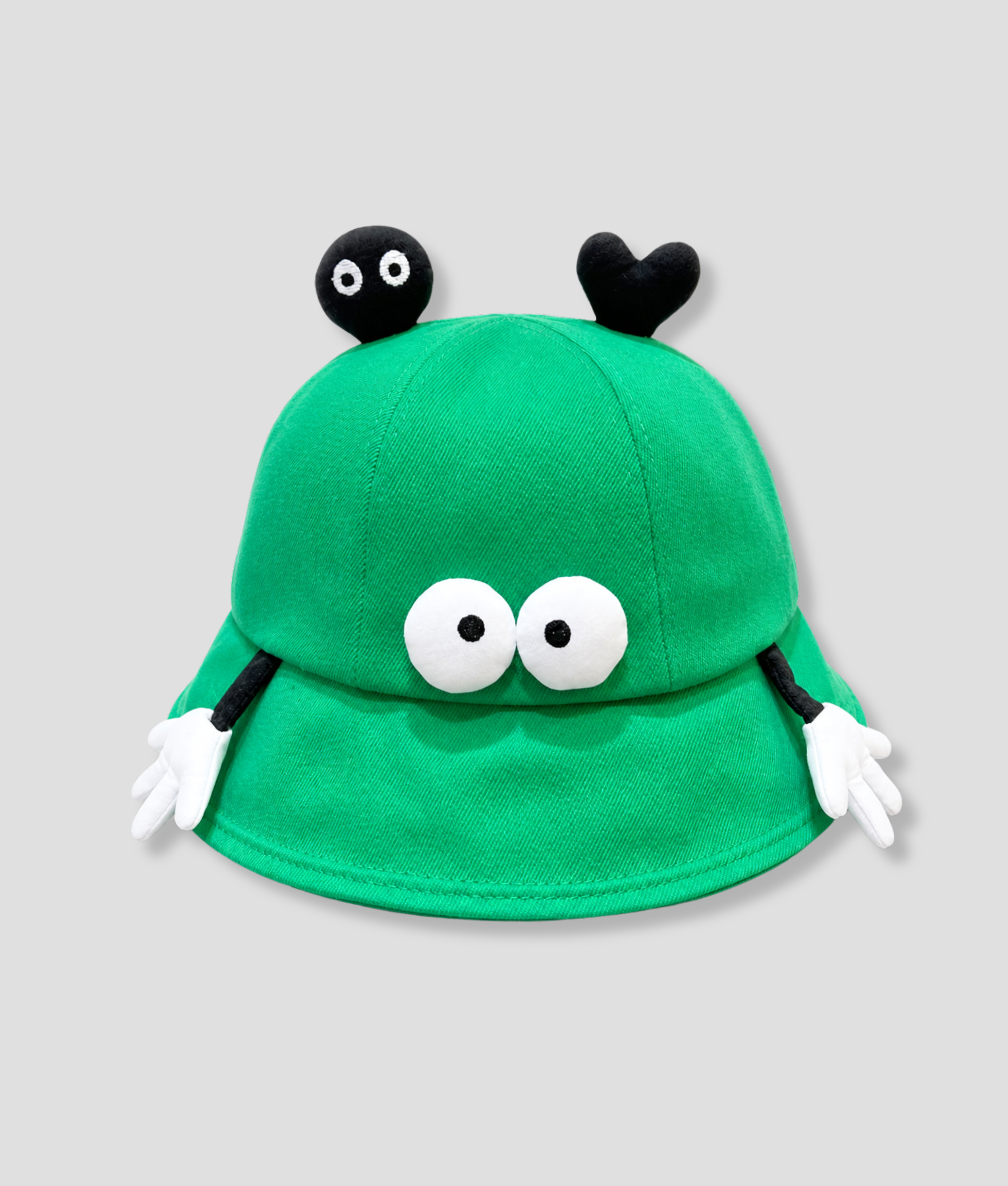PEP SCHEP groene bucket hat met speelse decoratieve flapjes – felgroene vissershoed met zwarte oogjes, hartje en kleine handjes als details