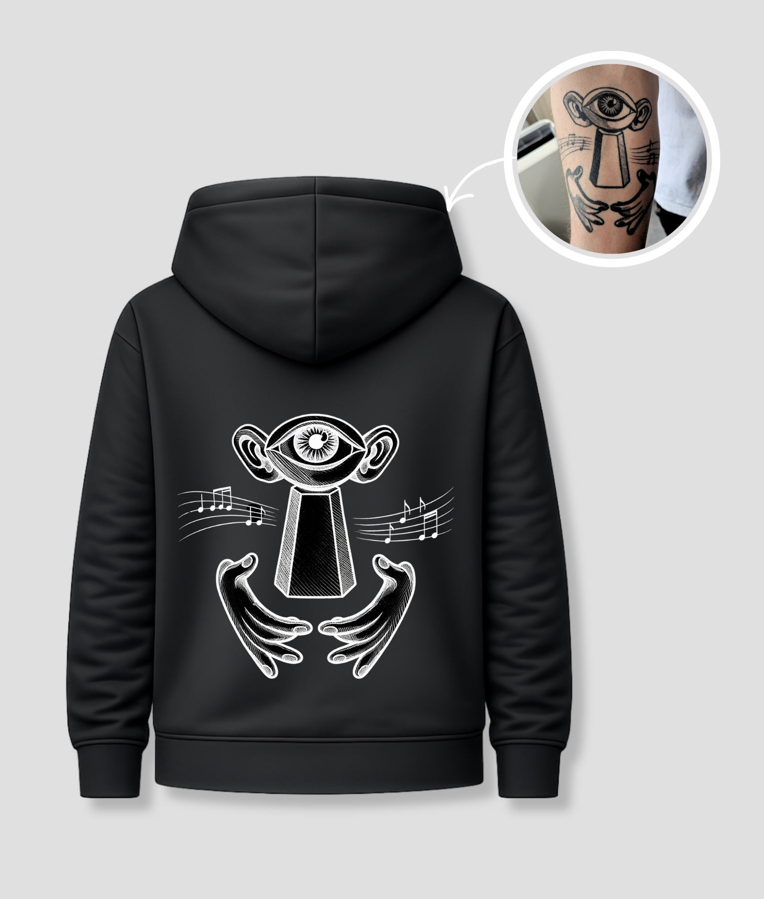 Zwarte unisex hoodie met surrealistisch oog-wezen opdruk van PEP SCHEP – grote witte rugprint met mystieke illustratie van figuur met oog, handen en muzieknoten