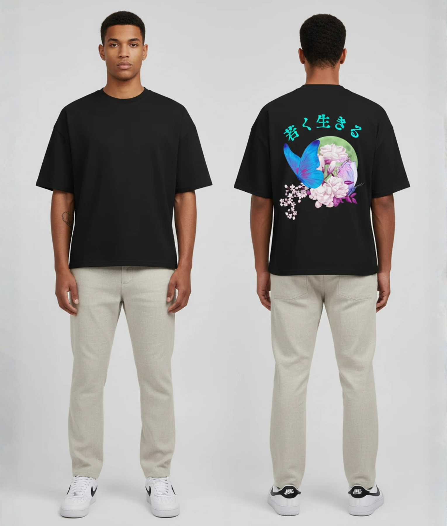 Zwart T-shirt met blauwe en paarse vlinders, kersenbloesem, groene maan en Japanse tekens in turquoise op de rug