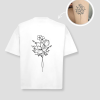 Wit oversized unisex t-shirt met bloemen boeket tattoo opdruk van PEP SCHEP – zwarte botanische bloem illustratie op de voorkant, eigen tattoo uploadbaar als print