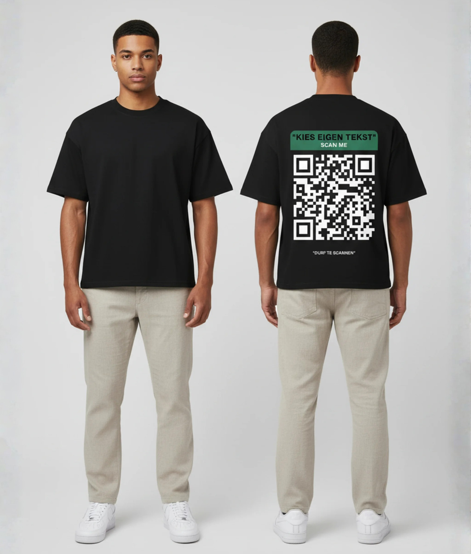 Zwart T-shirt met groene eigen tekst banner, grote witte QR-code en DURF TE SCANNEN tekst op de rug