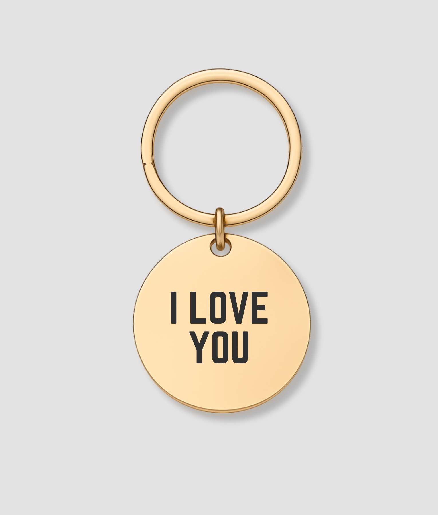 Ronde gouden sleutelhanger met zwarte tekst I LOVE YOU gravure
