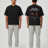 Zwart T-shirt met STAY IN THE MOMENT tekst en no-foto en no-phone iconen op de rug