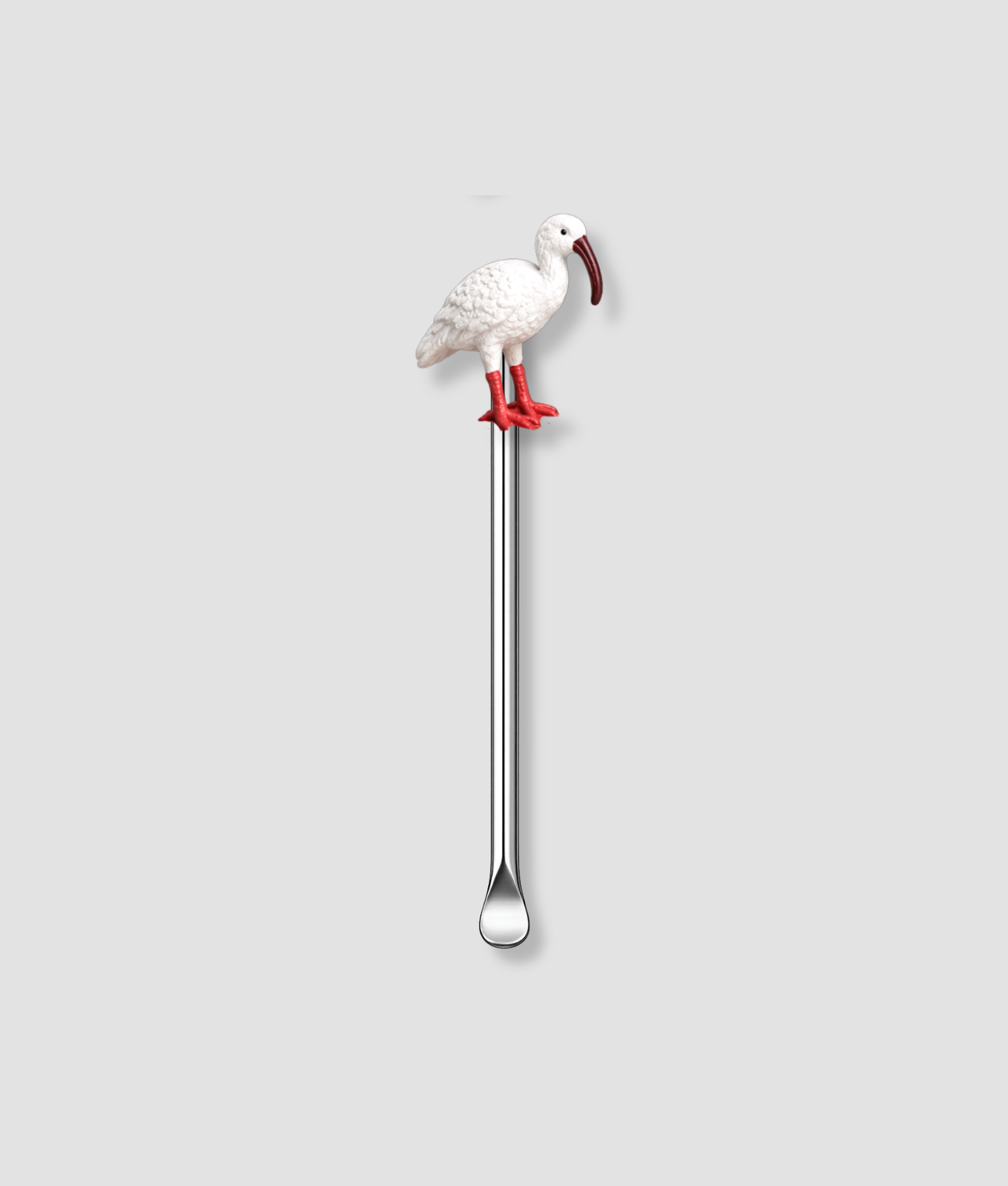 Mini schepje cocktailstirrer met witte ibis vogel figuur met rode poten bovenop en zilveren steel