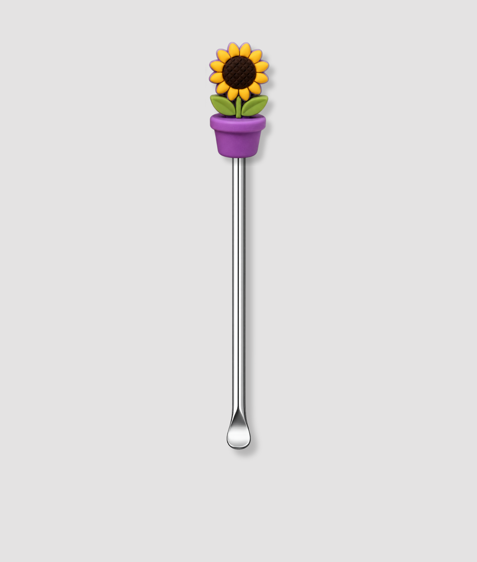 Mini schepje cocktailstirrer met zonnebloem figuur in paarse bloempot met groene bladeren bovenop en zilveren steel