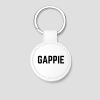 Witte ronde leren sleutelhanger met zilveren ring en tekst 'GAPPIE'