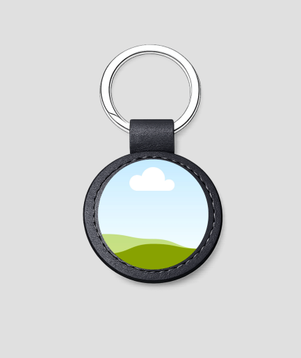 Zwarte ronde leren sleutelhanger met eigen afbeelding van een landschap