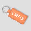 Perzikkleurige leren sleutelhanger die je zelf kunt personaliseren met eigen tekst