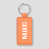 Perzikkleurige leren sleutelhanger met eigen tekst gegraveerd en metalen ring
