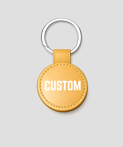 Gouden ronde leren sleutelhanger, voorbeeldtekst 'CUSTOM'