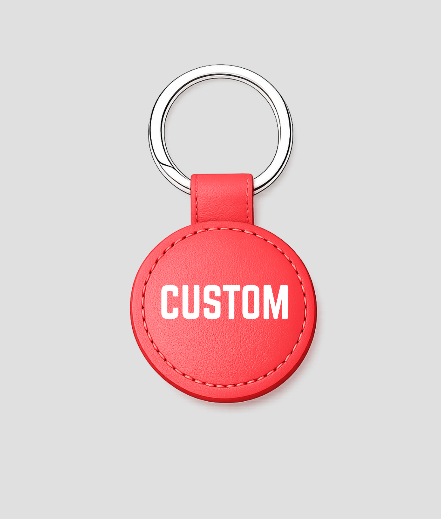 Rode ronde leren sleutelhanger, voorbeeldtekst 'CUSTOM'