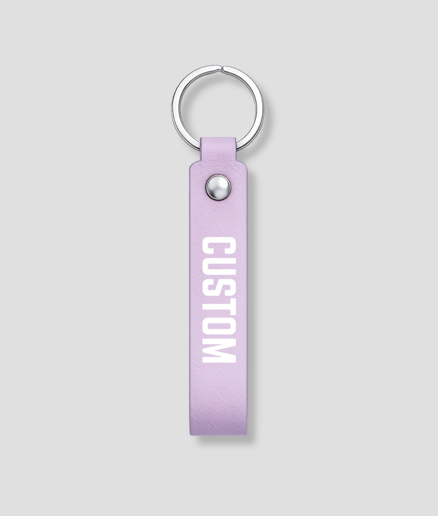 Lila leren sleutelhanger met zilveren ring, voorbeeldtekst 'CUSTOM'