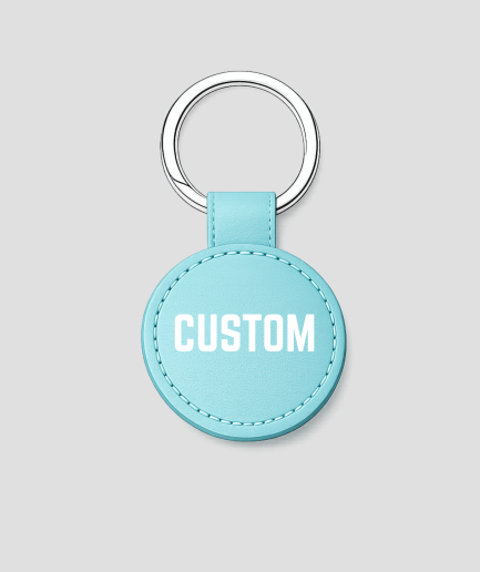 Turquoise ronde leren sleutelhanger met zilveren ring, voorbeeldtekst 'CUSTOM'