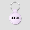 Lila ronde leren sleutelhanger met zilveren ring en tekst 'BESTE JUF'