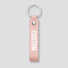 Roze leren sleutelhanger met zilveren ring, voorbeeldtekst 'CUSTOM'