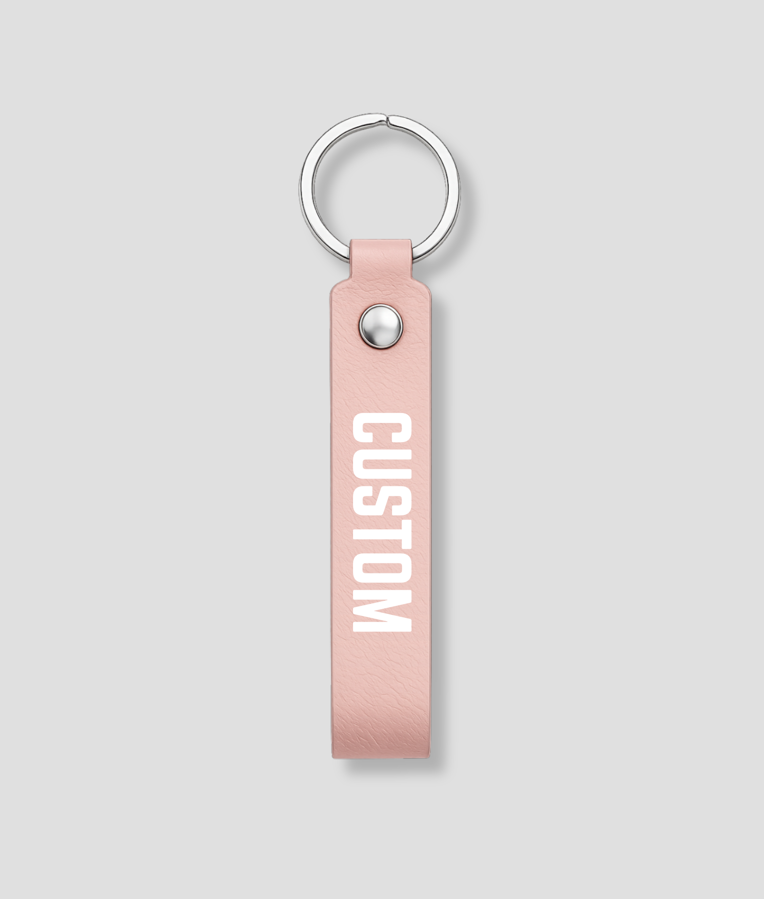 Roze leren sleutelhanger met zilveren ring, voorbeeldtekst 'CUSTOM'