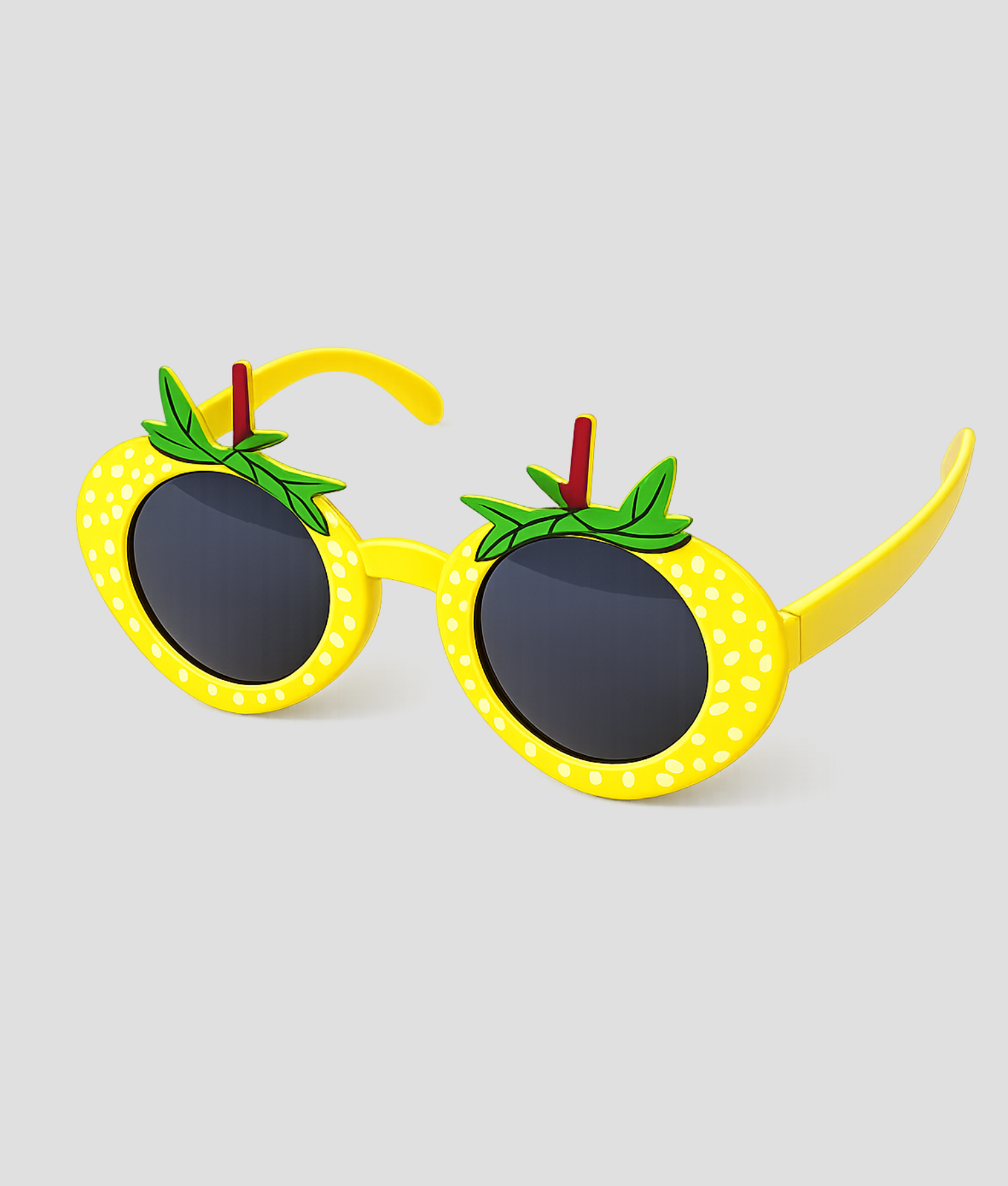 Gele ronde zonnebril in de vorm van een ananas met witte stipjes