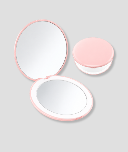 Roze ronde LED make-up spiegel in zakformaat, open en gesloten