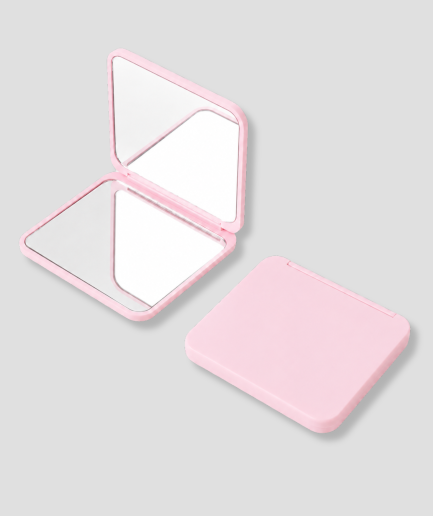 Roze opvouwbare mini spiegel voor vrouwen, opengeklapt met dubbele spiegel