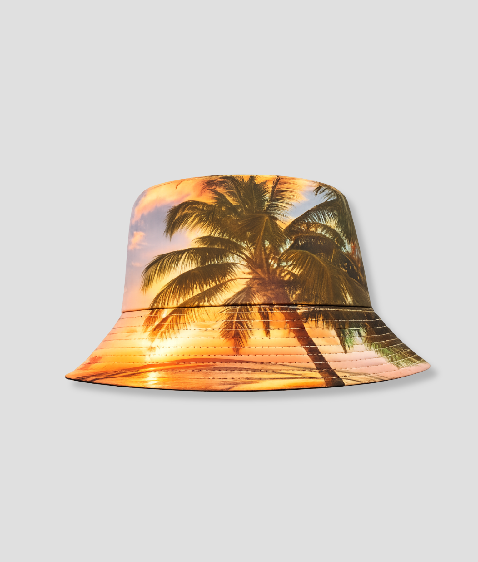 Bucket hat met print van zonsondergang en palmbomen
